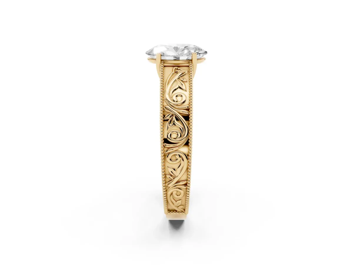 Oval Cut Diamond Solitaire Ring with Engraved Band and Four-Prong Setting Yellow gold