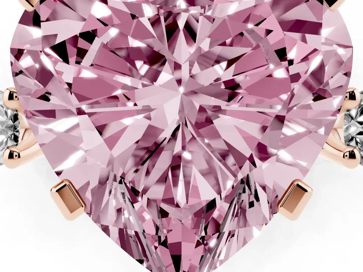 Fancy Pink Heart Cut Cut Three-Stone Solitaire Ring with Round Accent Diamonds and Four-Prong Setting Rose gold