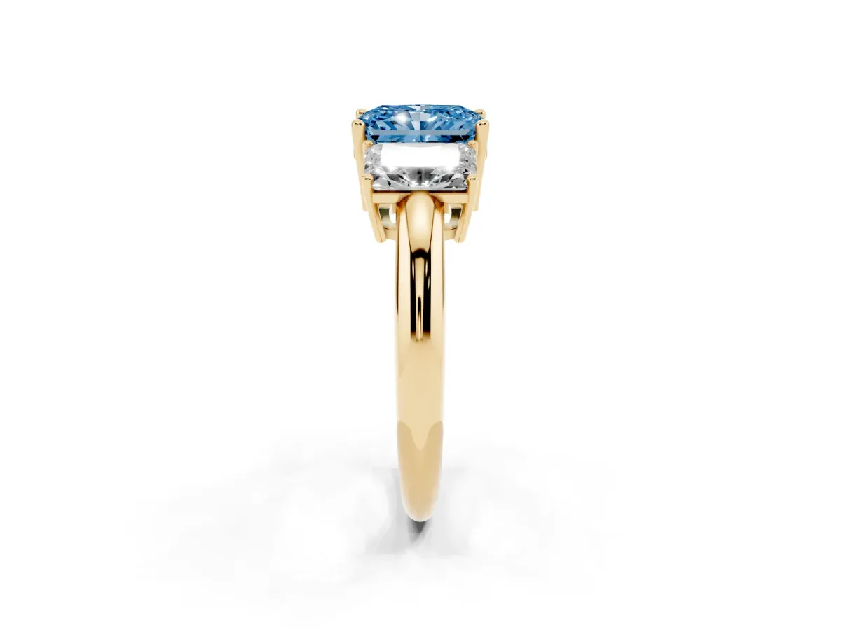 Fancy Blue Three-Stone Radiant Cut Cut Diamond Engagement Ring with Prong Setting on a White Gold Band Yellow gold