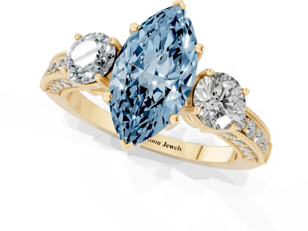 Fancy Blue Marquise Cut Three-Stone Diamond Ring with Pavé Band and Four-Prong Setting Yellow gold