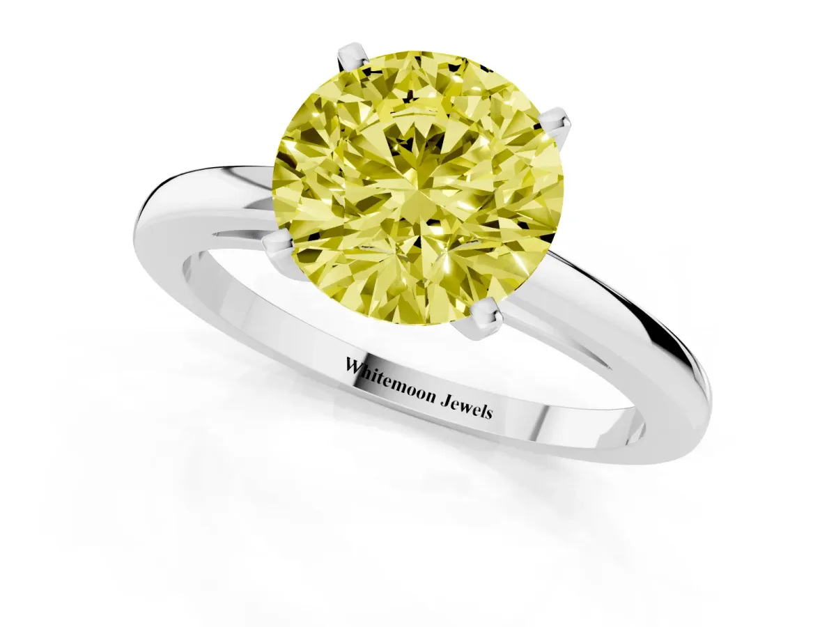 Fancy Yellow Round Cut Solitaire Diamond Engagement Ring with Four-Prong Setting on a Classic Band Platinum