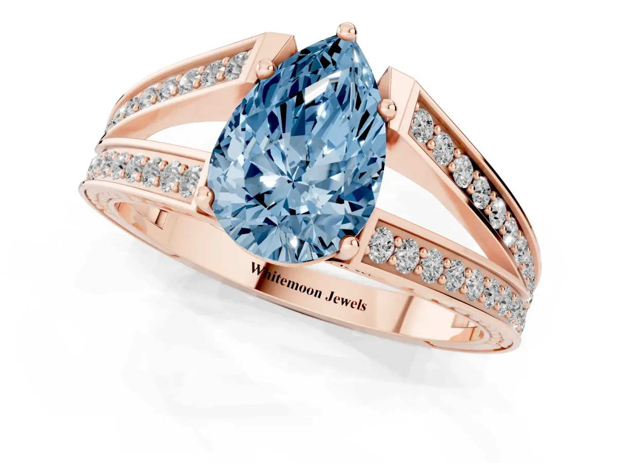 Fancy Blue Pear Cut Diamond Split Shank Ring with Pavé Band and Four-Prong Setting Rose gold