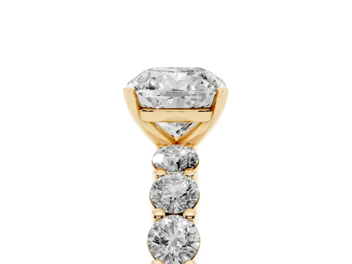 Cushion Cut Diamond Solitaire Ring with Shared Prong Round Side Stones Yellow gold