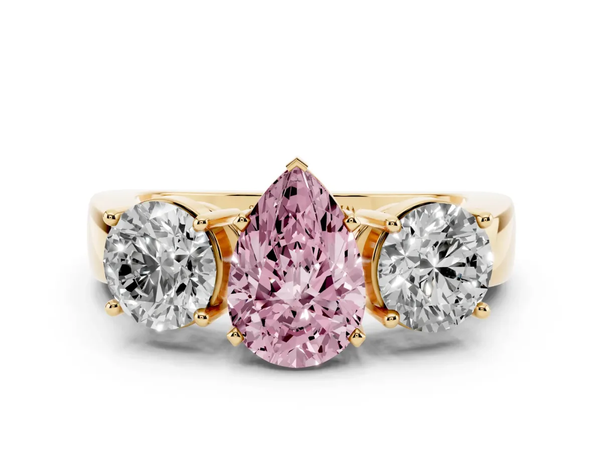 Fancy Pink Three-Stone Pear Cut Diamond Ring with Round Side Stones, Classic Band, and Four-Prong Setting Yellow gold