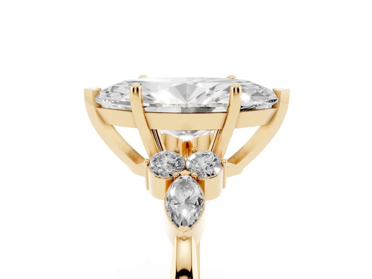 Marquise Cut Brilliant Diamond Solitaire Ring with Pear Side Stones and Four-Prong Setting Yellow gold