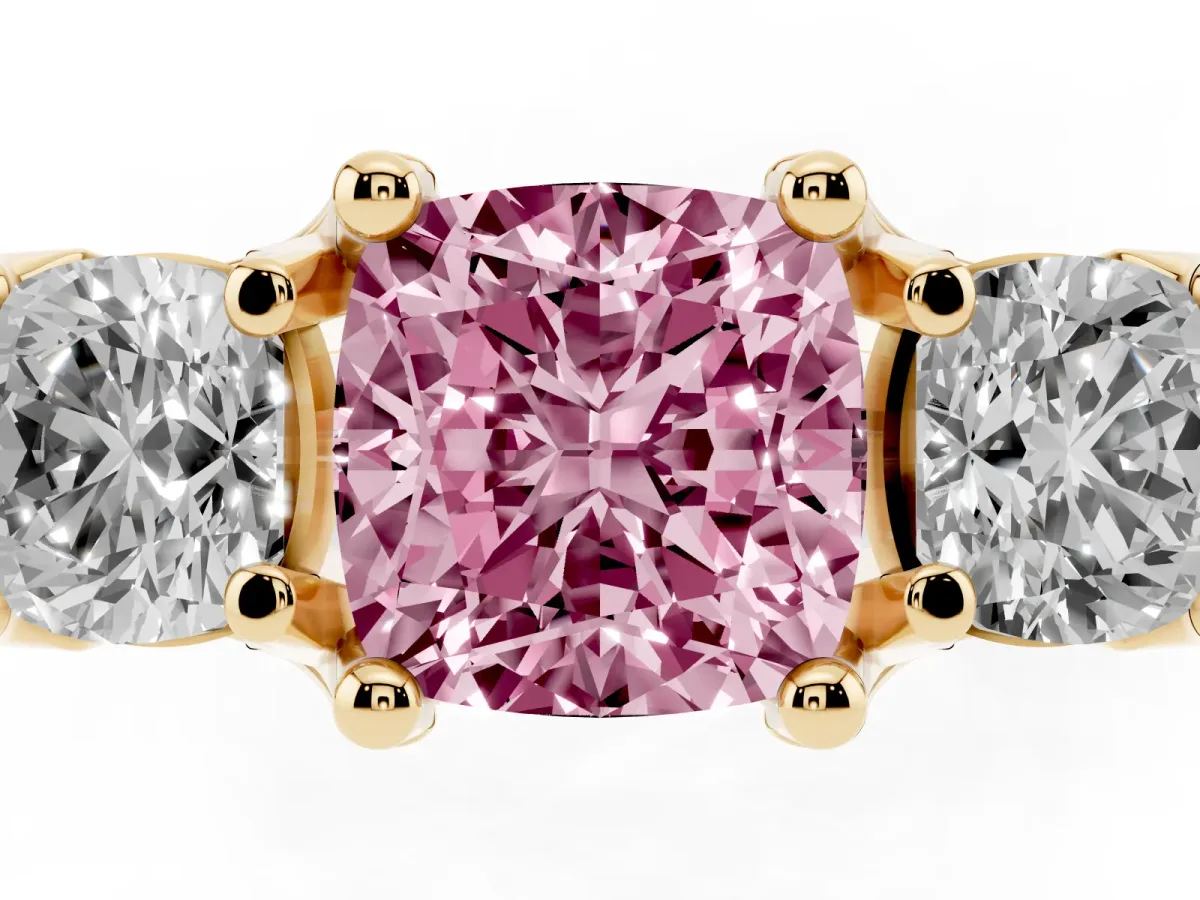 Fancy Pink Cushion Cut Diamond Three-Stone Ring with Channel Set Band and Four-Prong Setting Yellow gold