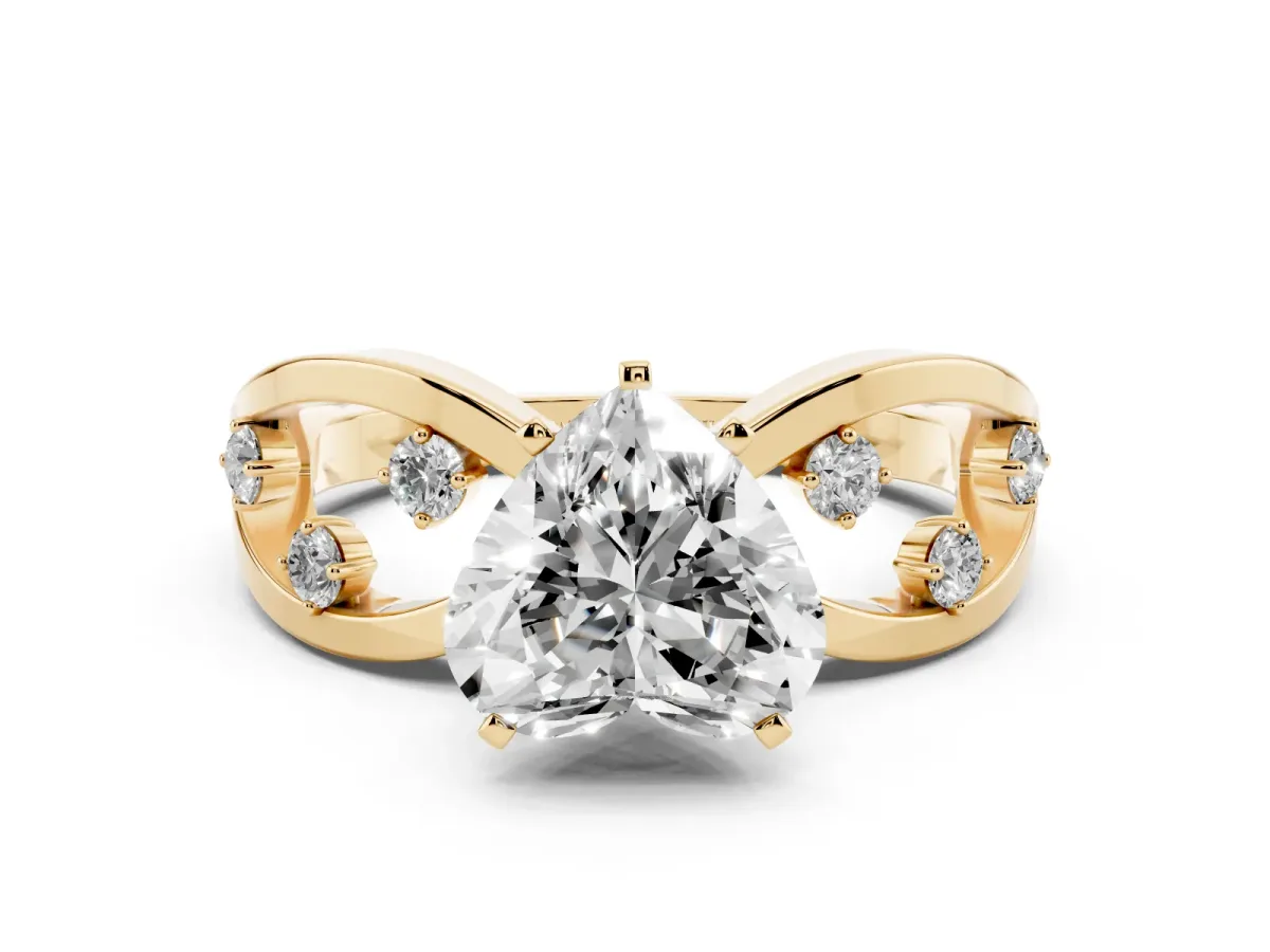 Heart Cut Cut Solitaire Diamond with Side Stones on Criss-Cross Band and Four-Prong Setting Yellow gold