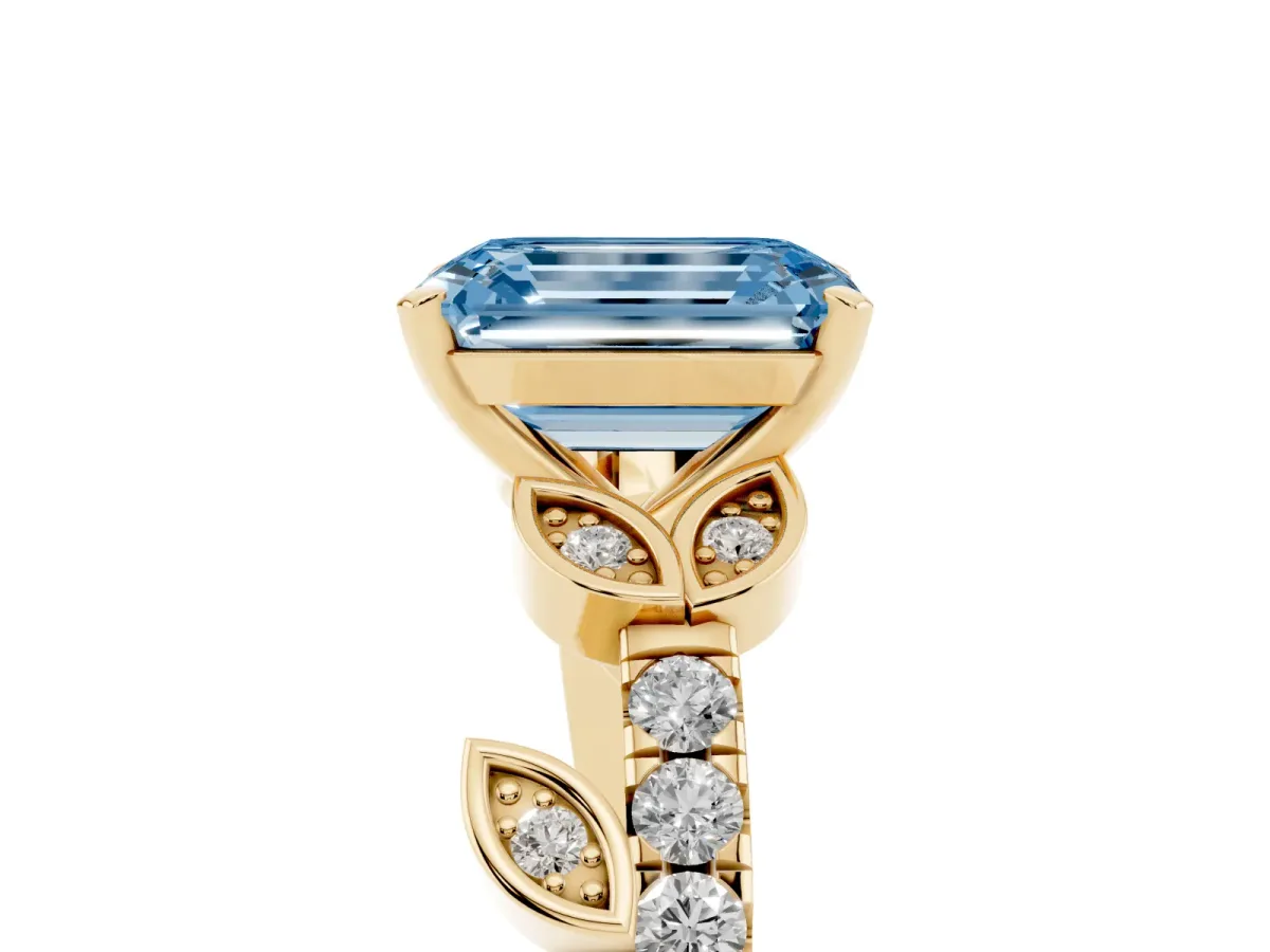 Fancy Blue Emerald Cut Solitaire Leaf-Inspired Diamond Ring with Pavé Band and Four-Prong Setting Yellow gold