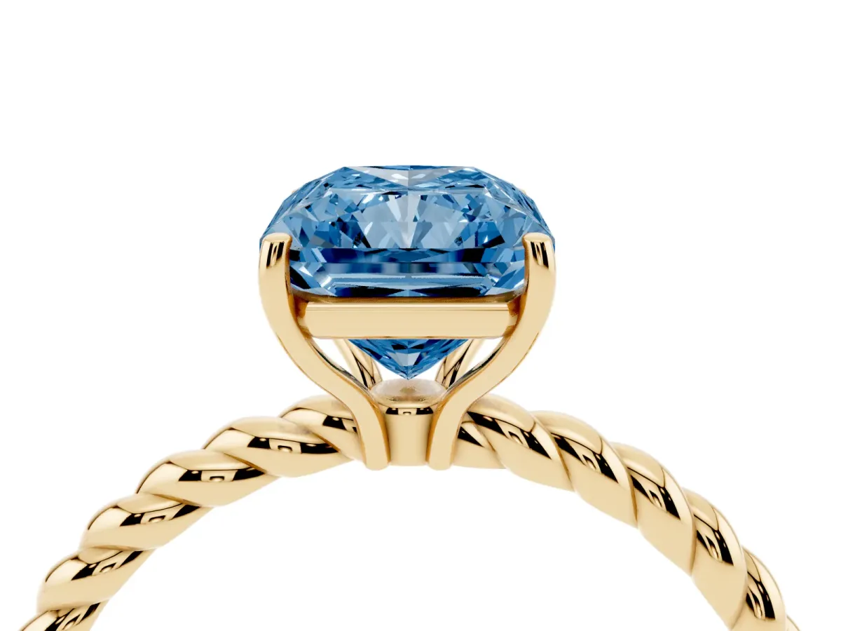 Fancy Blue Radiant Cut Solitaire Twist Band Ring with Four-Prong Setting Yellow gold