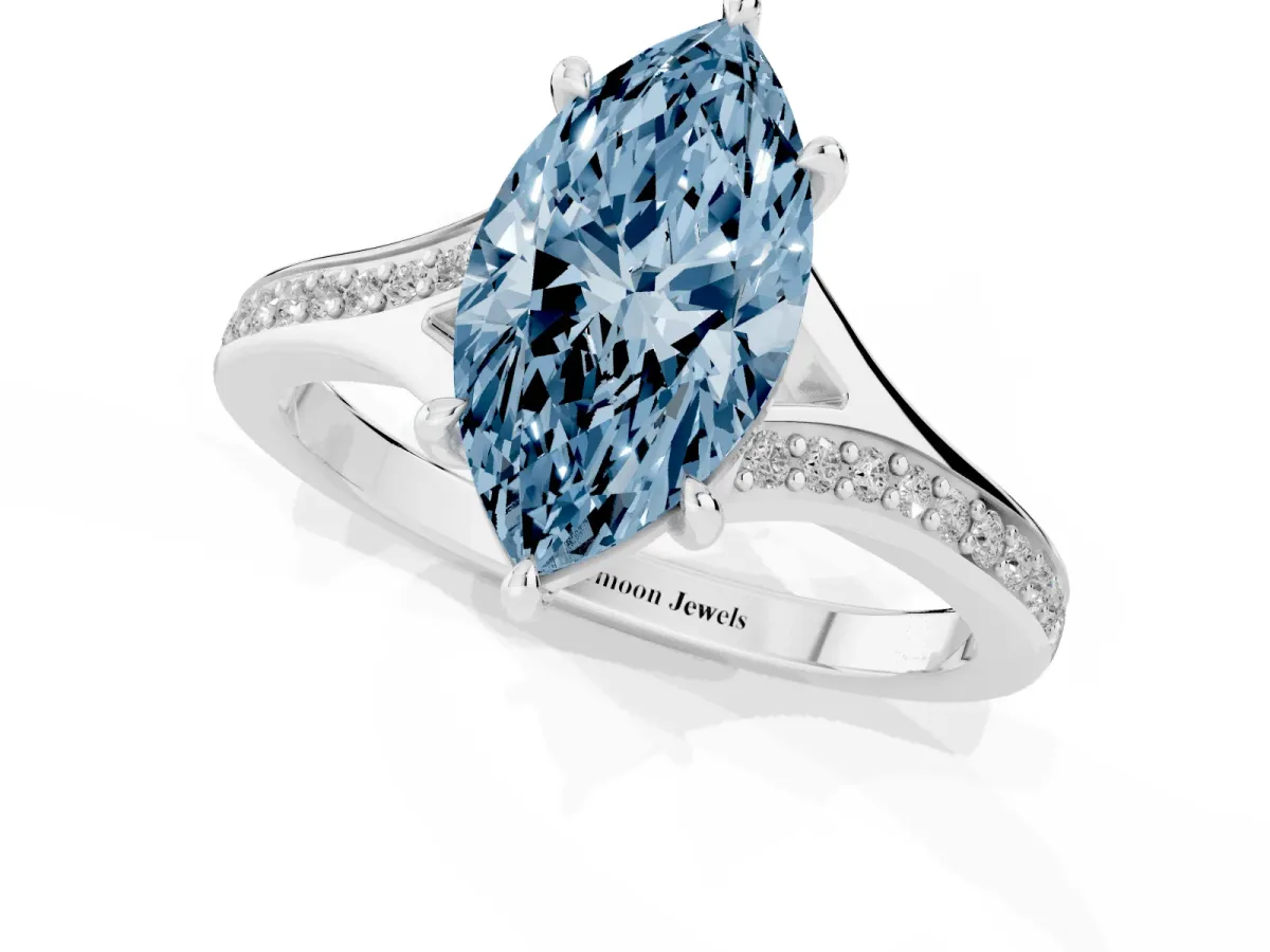 Fancy Blue Marquise Cut Diamond Solitaire Ring with Pavé Band and Prong Setting Silver