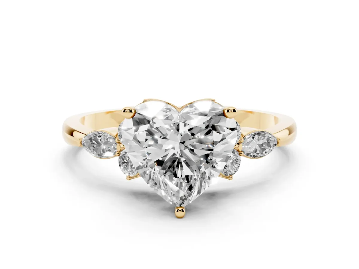 Heart Cut Brilliant Diamond Solitaire Ring with Pear Side Stones and Four-Prong Setting Yellow gold