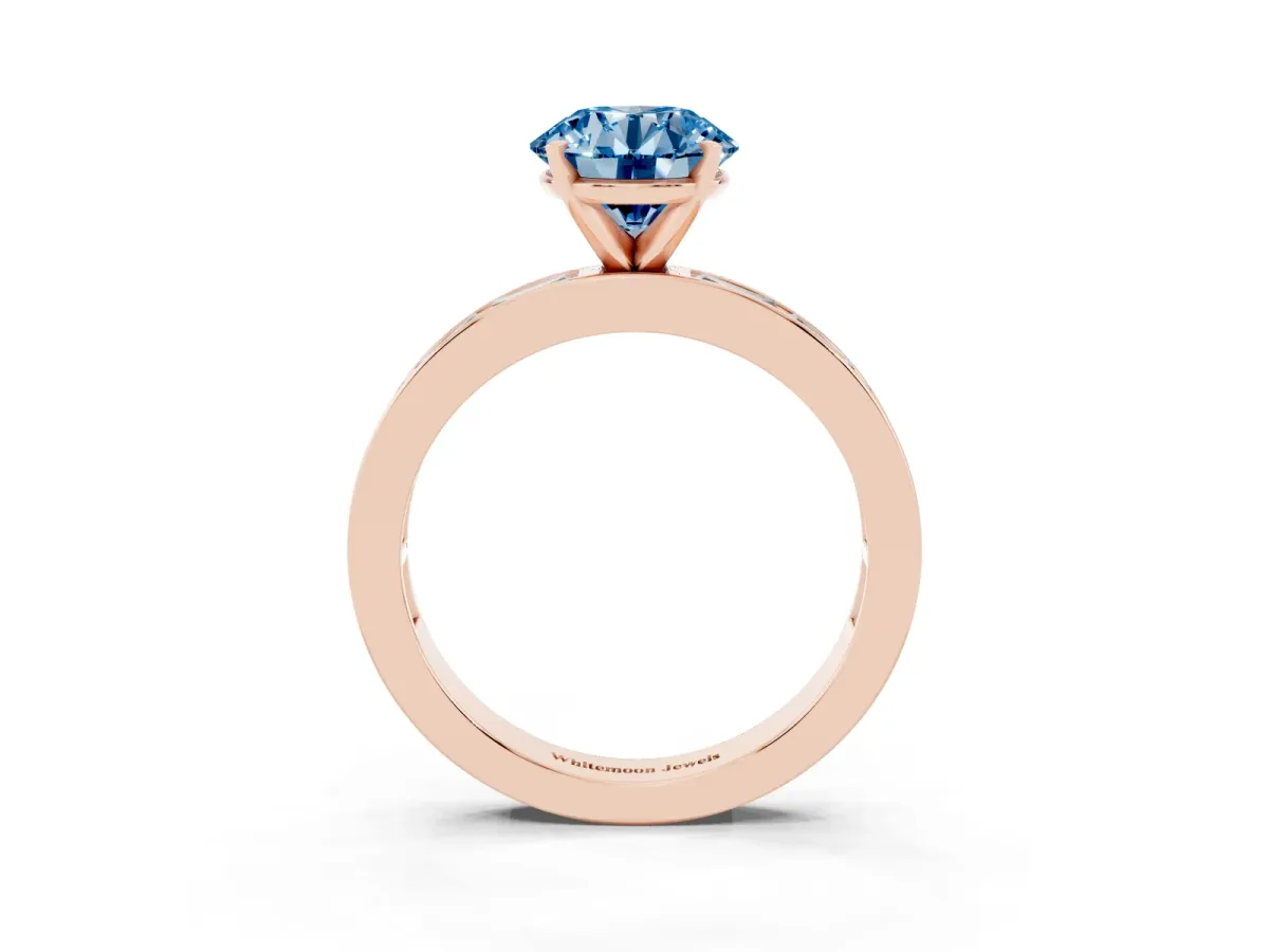 Fancy Blue Round Cut Solitaire Diamond Ring with Channel-Set Baguette Band and Four-Prong Setting Rose gold