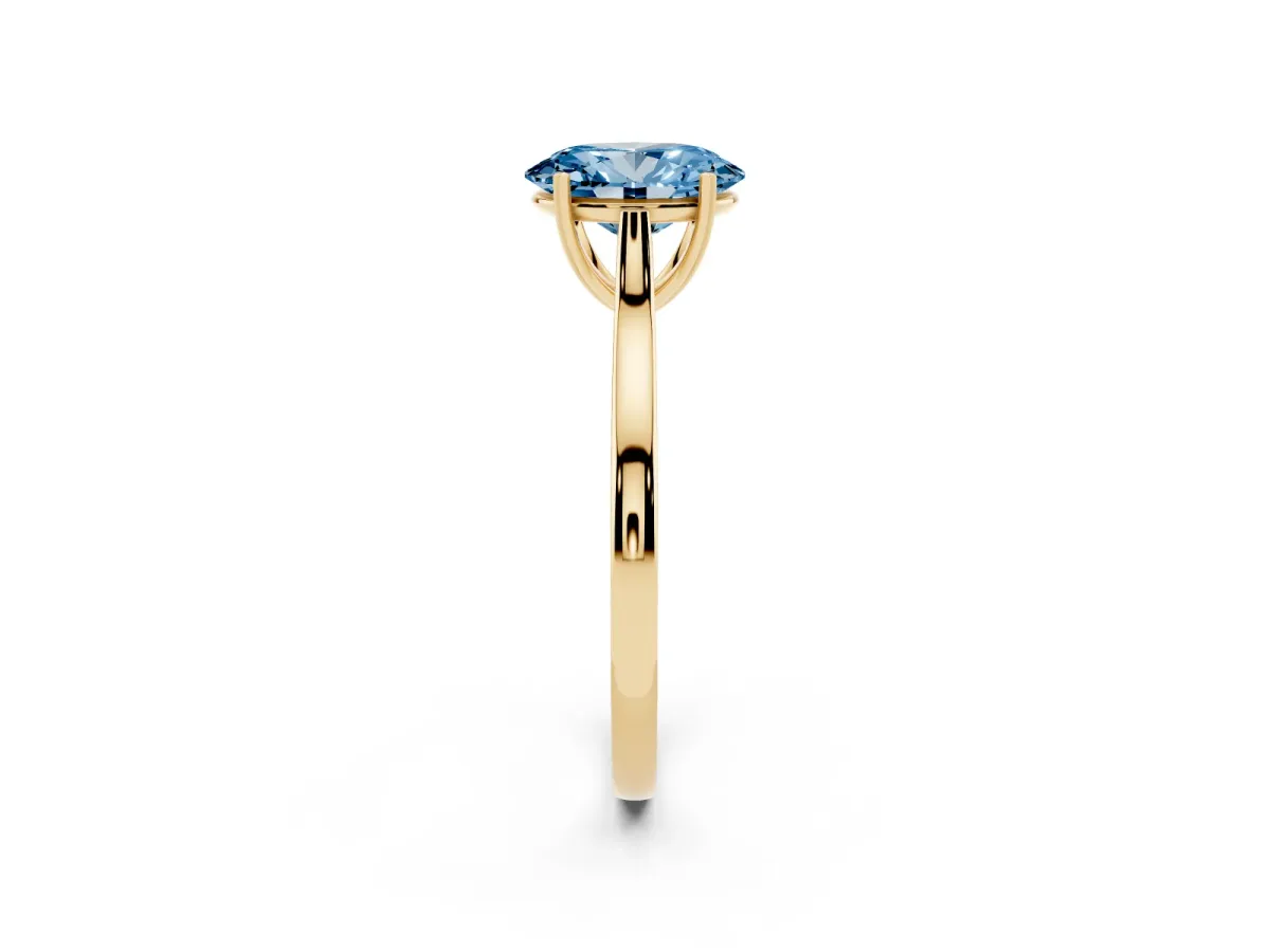 Fancy Blue Oval Cut Solitaire Heart Prong Engagement Ring with Tapered Band Yellow gold