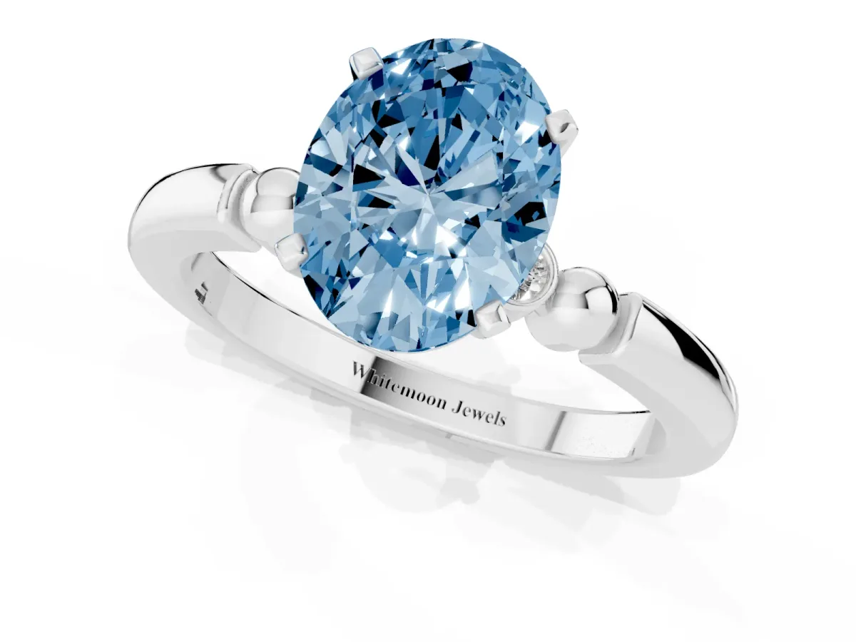 Fancy Blue Oval Cut Solitaire Beaded Band with Four-Prong Setting White gold