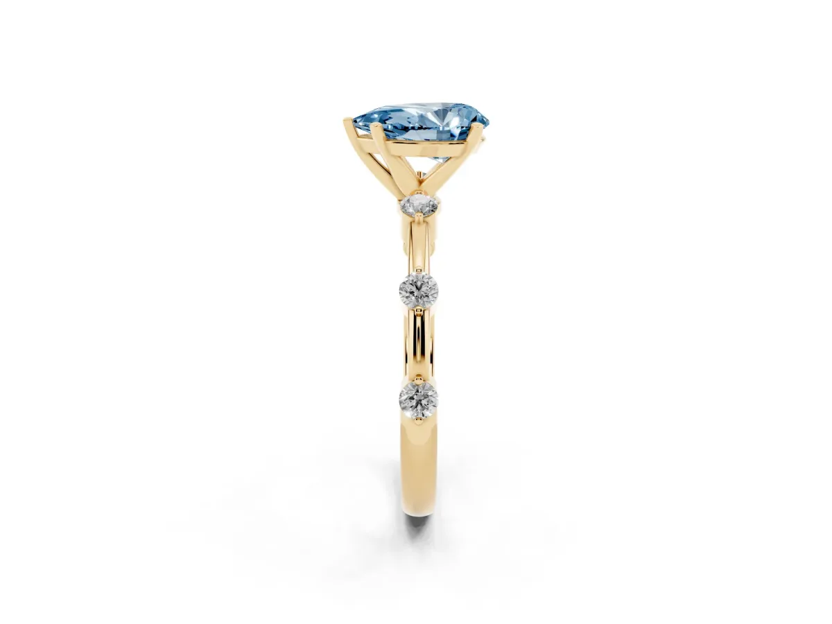 Fancy Blue Pear Cut Solitaire Diamond Ring with Bezel Set Side Stones and Prong Setting Yellow gold