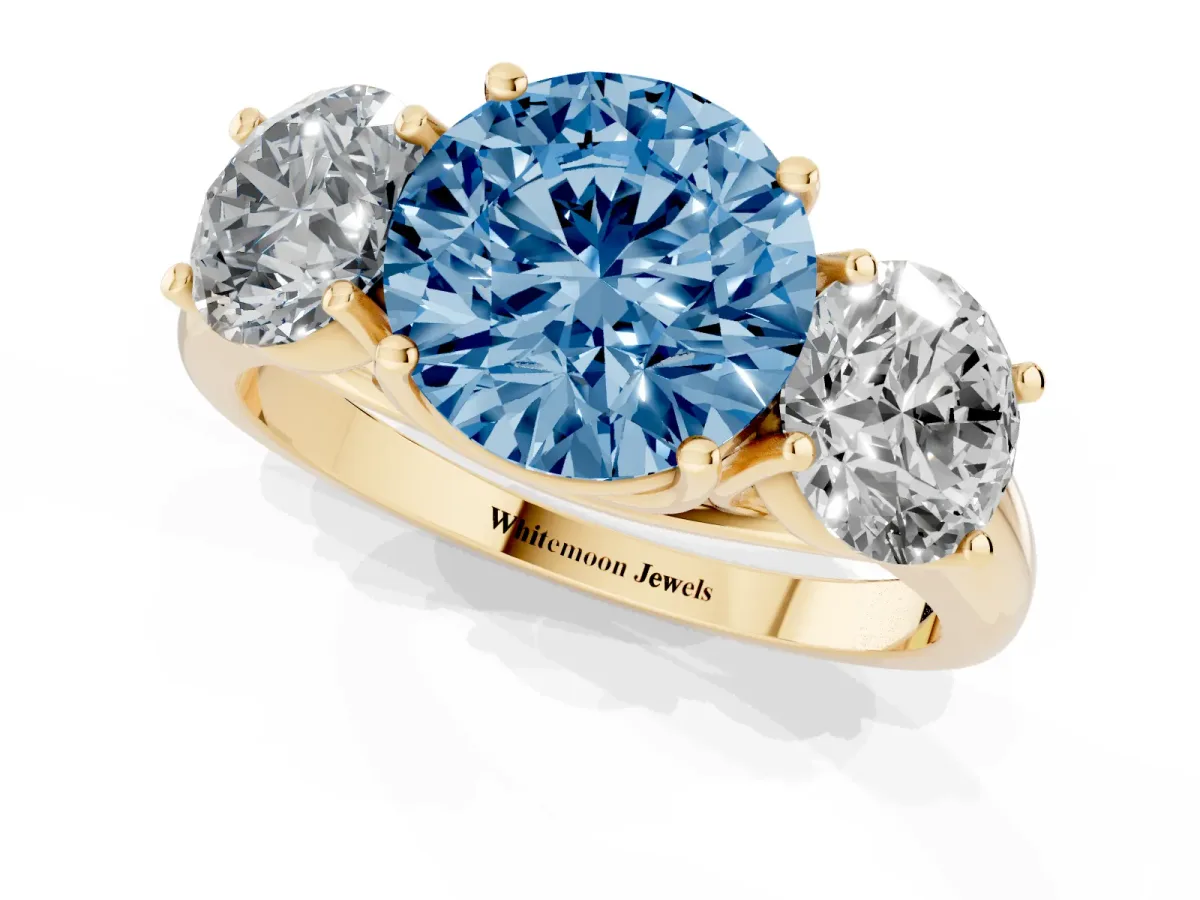 Fancy Blue Three-Stone Round Cut Diamond Engagement Ring with Prong Setting Yellow gold