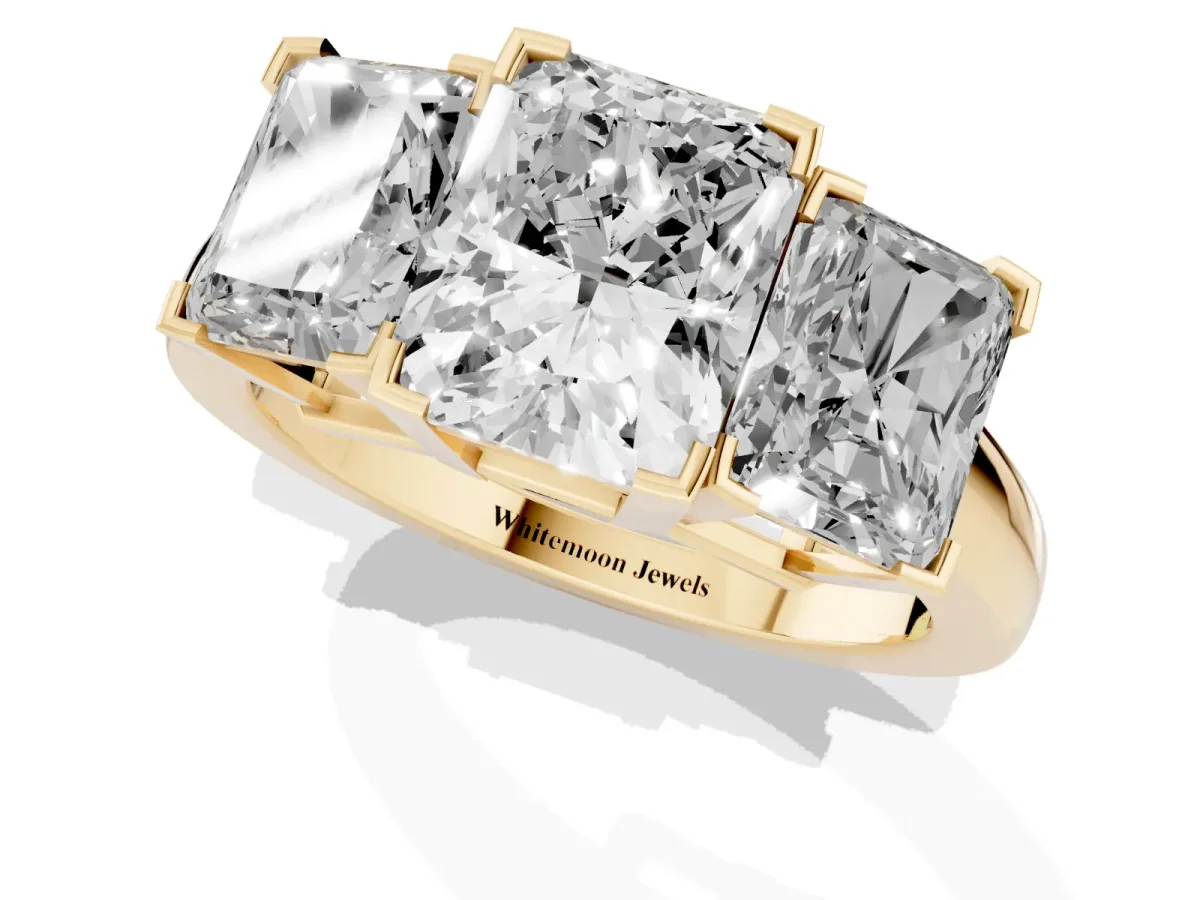 Three-Stone Radiant Cut Cut Diamond Ring with Channel Set Band and Four-Prong Setting Yellow gold