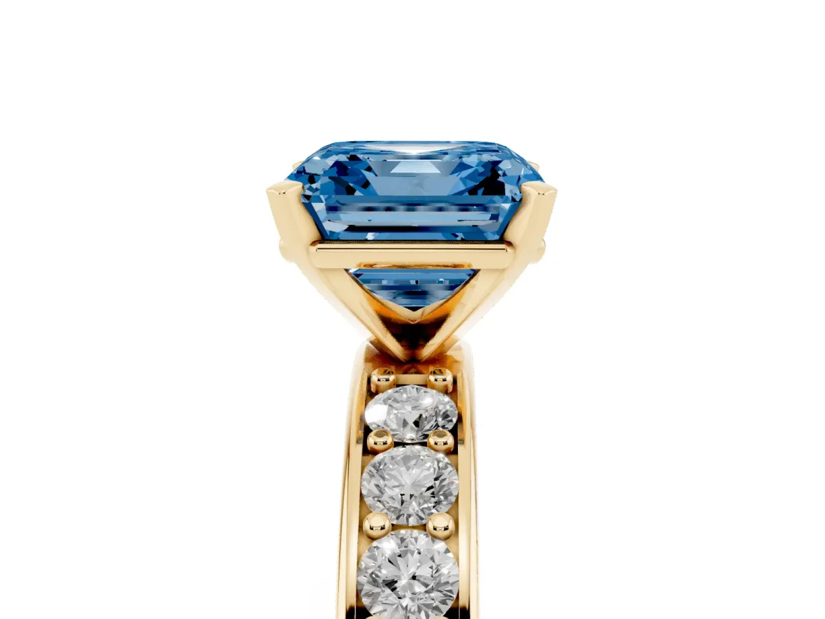 Fancy Blue Asscher Cut Diamond Engagement Ring with Channel Set Round Band and Prong Setting Yellow gold