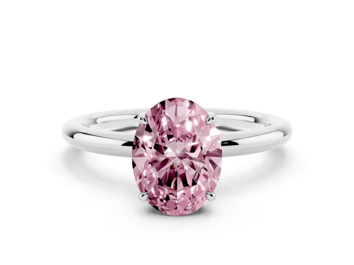 Fancy Pink Oval Cut Diamond Solitaire Ring with Thin Band and Four-Prong Setting Silver