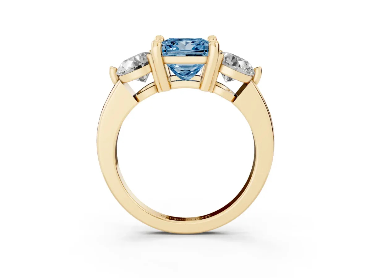 Fancy Blue Three-Stone Princess Cut Brilliant Cut Solitaire Ring with Prong Setting on a Classic Band Yellow gold