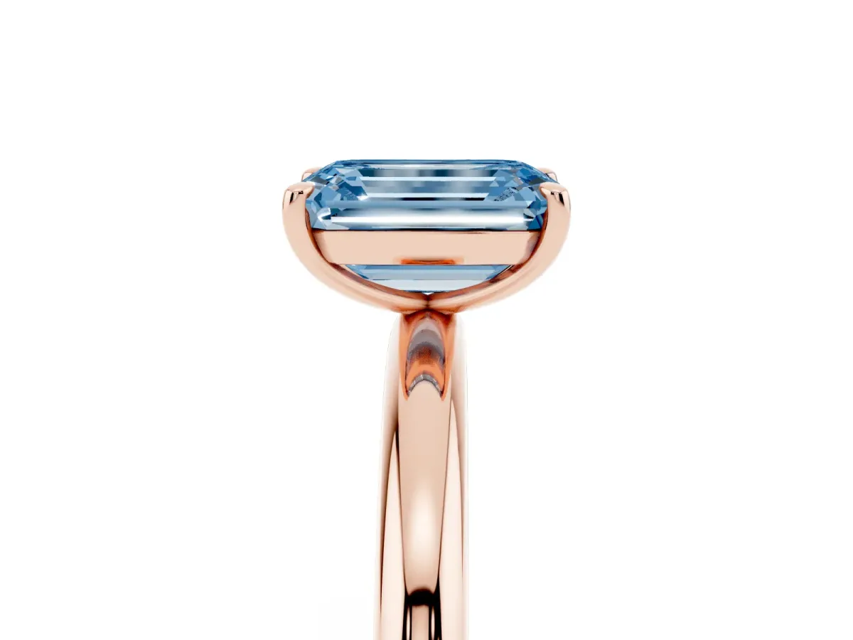 Fancy Blue Emerald Cut Solitaire Diamond Ring with Four-Prong Setting on a Plain Band Rose gold