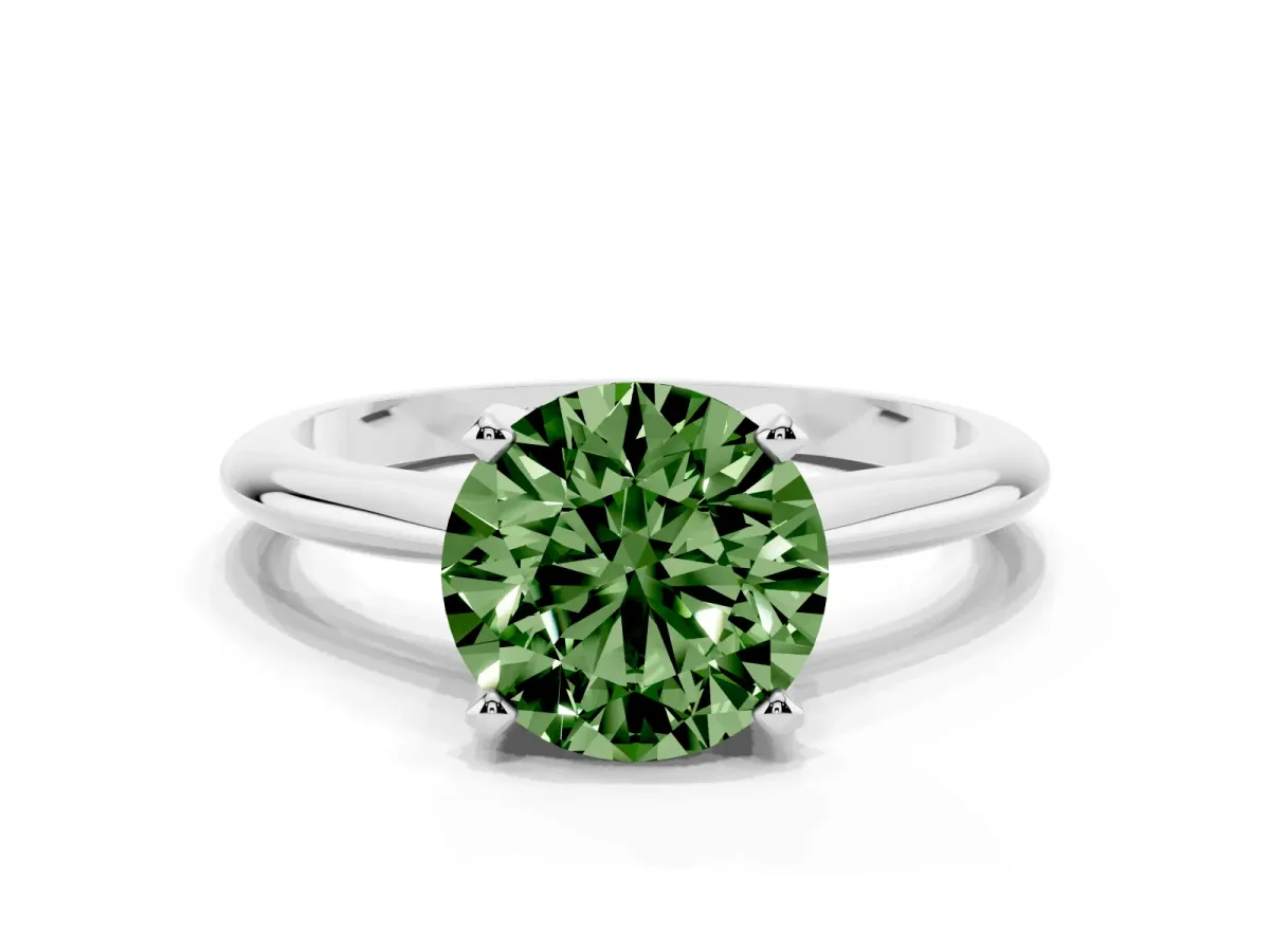 Fancy Green Round Cut Cut Solitaire Ring with Four-Prong Setting on a Classic Band Silver