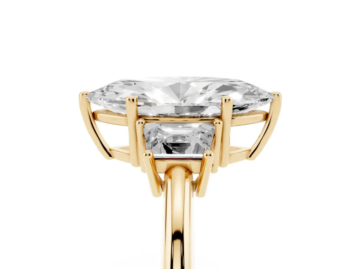 Marquise Cut Diamond Three-Stone Ring with Trapezoid Side Stones and Prong Setting Yellow gold