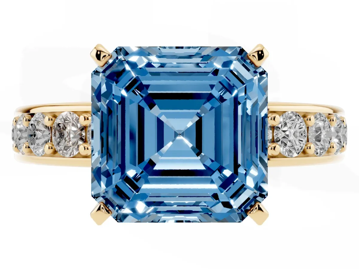 Fancy Blue Asscher Cut Diamond Engagement Ring with Channel Set Round Band and Prong Setting Yellow gold