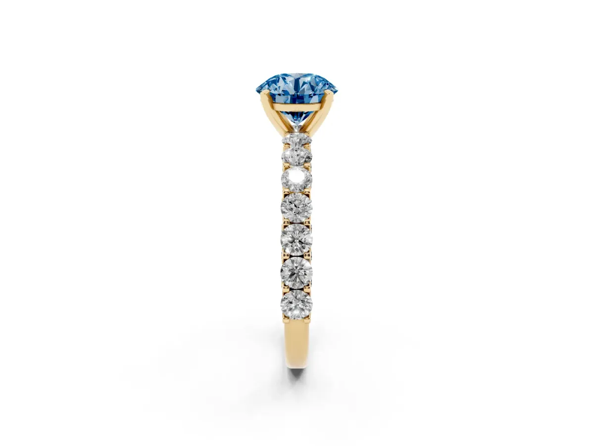 Fancy Blue Round Cut Diamond Solitaire Ring with Shared Prong Pavé Band and Four-Prong Setting Yellow gold