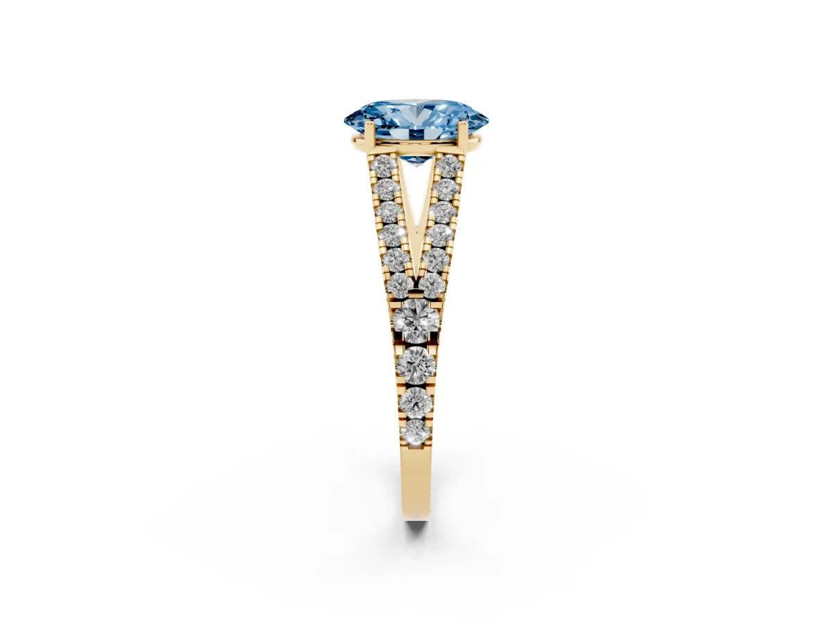 Fancy Blue Oval Cut Diamond Split Shank Pavé Engagement Ring with Four-Prong Setting Yellow gold