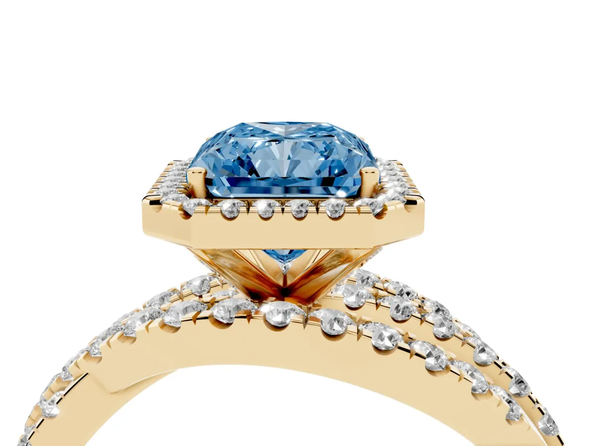 Fancy Blue Radiant Cut Diamond Halo Ring with Round Split Shank and Prong Setting Yellow gold