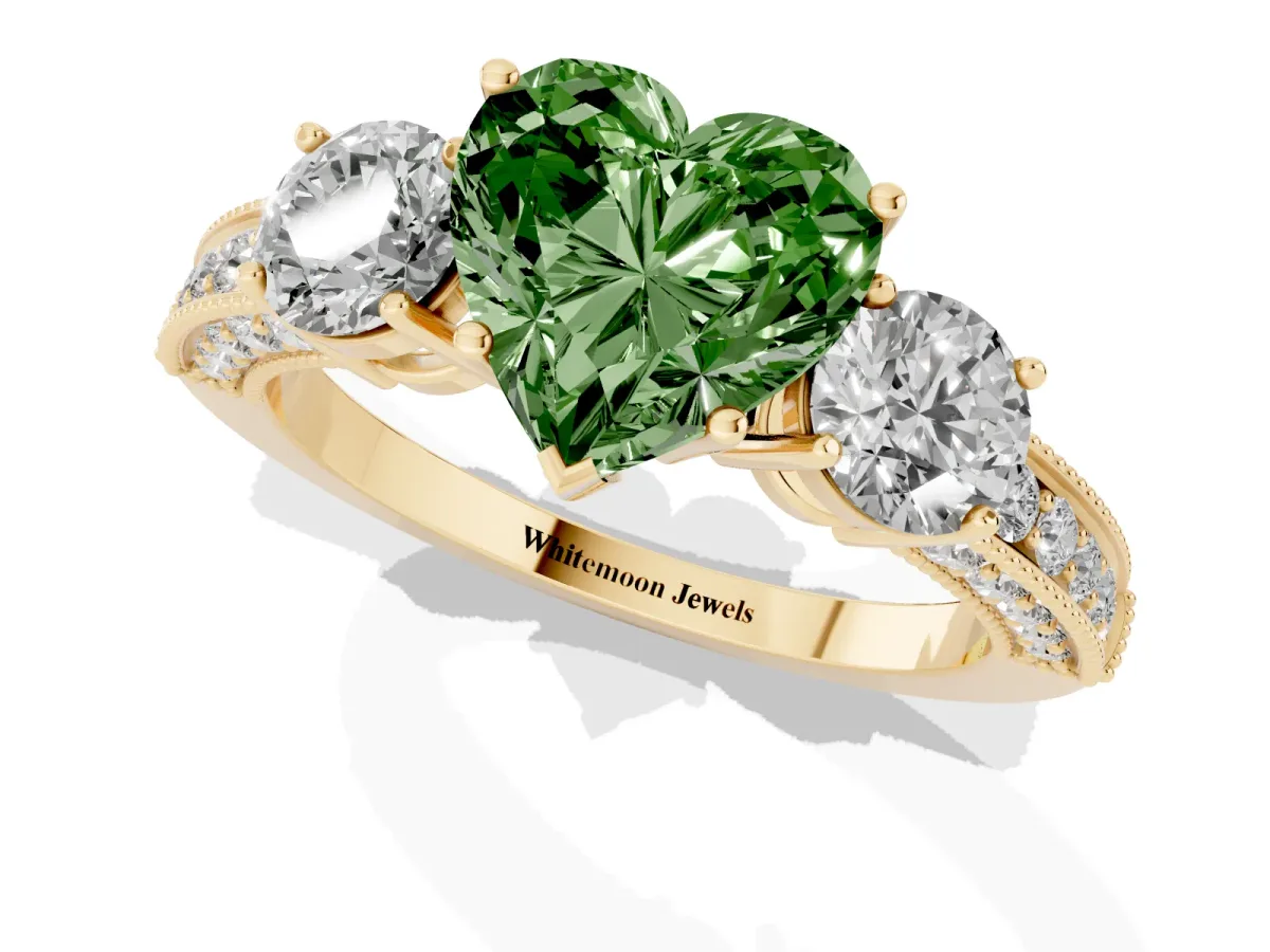 Fancy Green Heart Cut Three-Stone Diamond Ring with Pavé Band and Four-Prong Setting Yellow gold