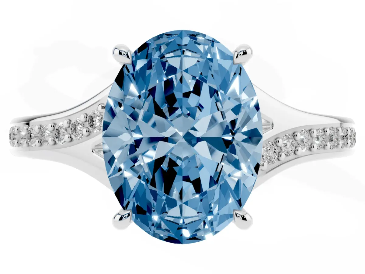 Fancy Blue Oval Cut Diamond Solitaire Ring with Pavé Band and Prong Setting Silver