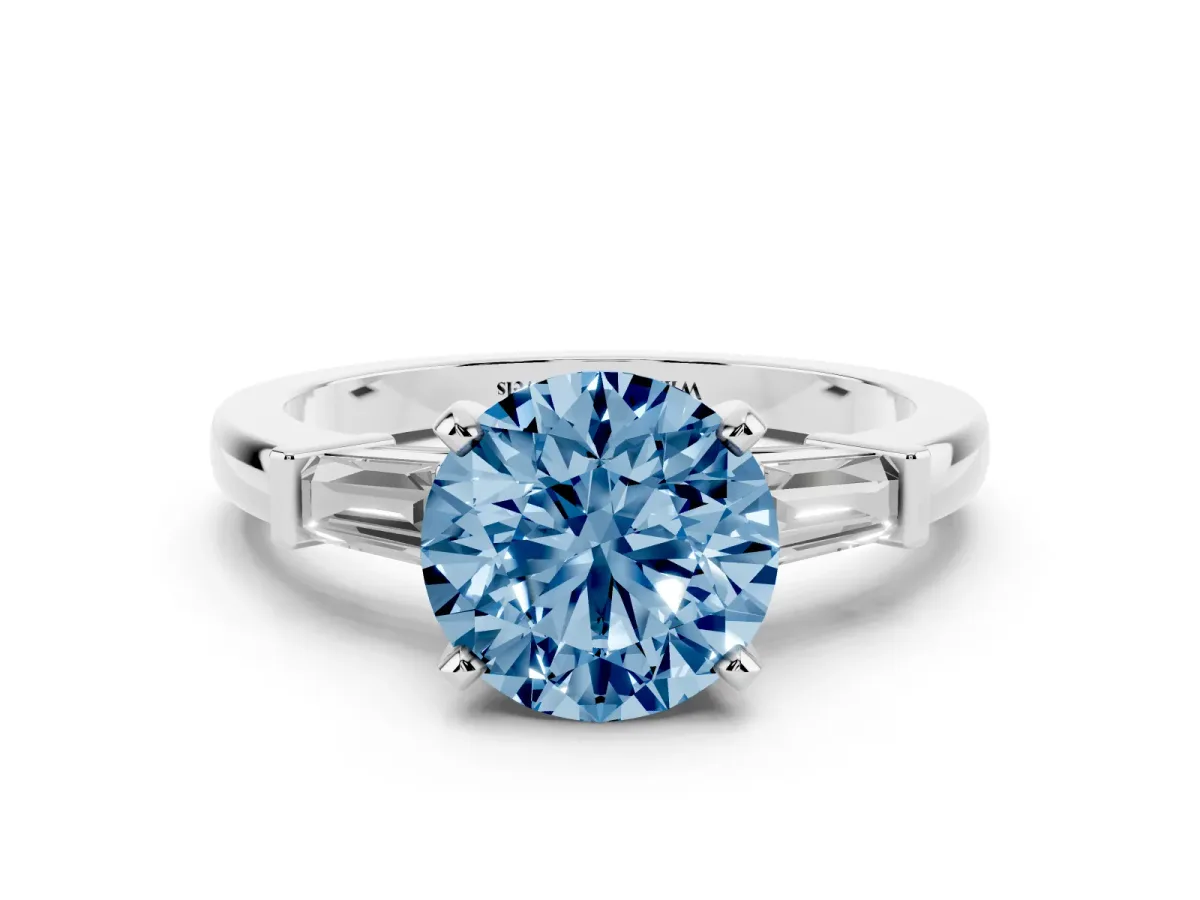 Fancy Blue Round Cut Cut Diamond Solitaire Ring with Tapered Baguette Accents and Four-Prong Setting White gold