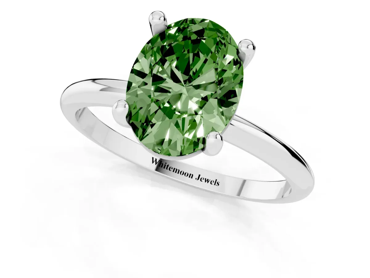 Fancy Green Oval Cut Solitaire Diamond Ring with 4-Prong Setting on a Classic Band Silver