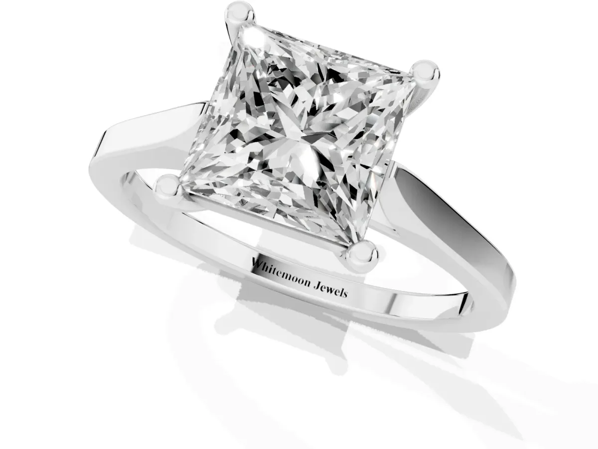 Princess Cut Solitaire Diamond Ring with Four-Prong Setting and Tapered Band Silver