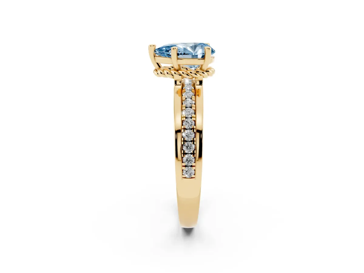 Fancy Blue Pear Cut Solitaire Diamond Ring with Channel Set Band and Six-Prong Setting Yellow gold