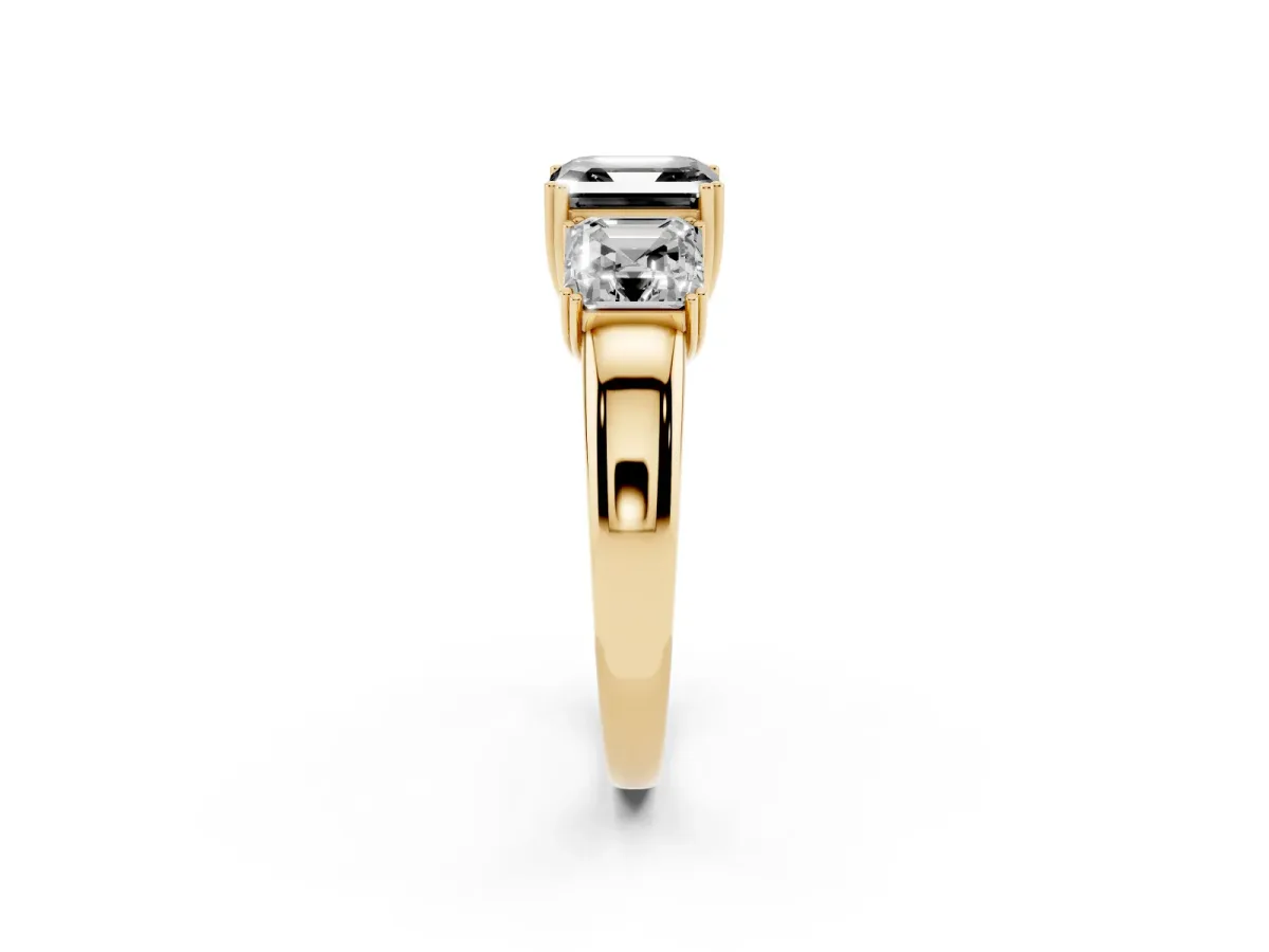 Fancy Black Three-Stone Asscher Cut Cut Diamond Ring with Channel Set Band and Four-Prong Setting Yellow gold