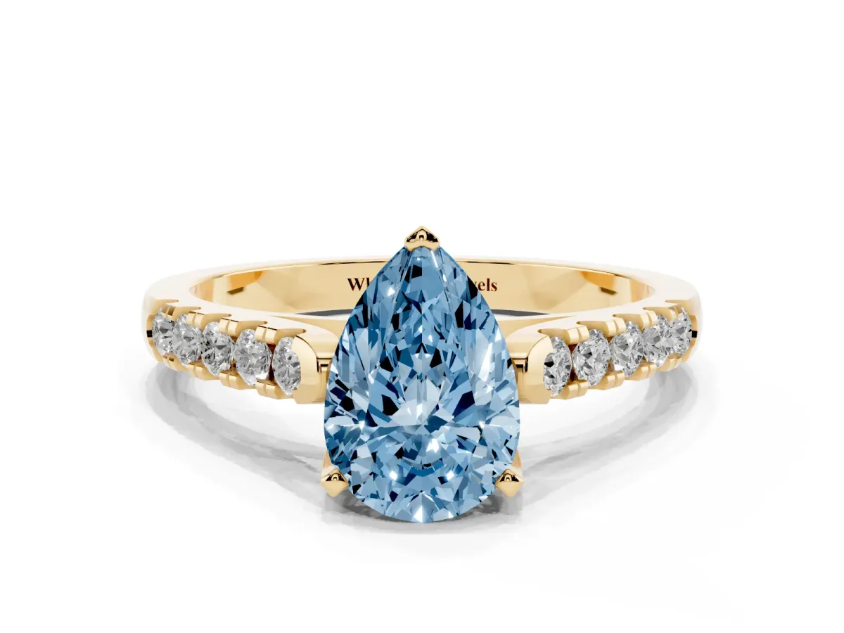 Fancy Blue Pear Cut Diamond Pavé Band Solitaire Ring with Prong Setting Yellow gold