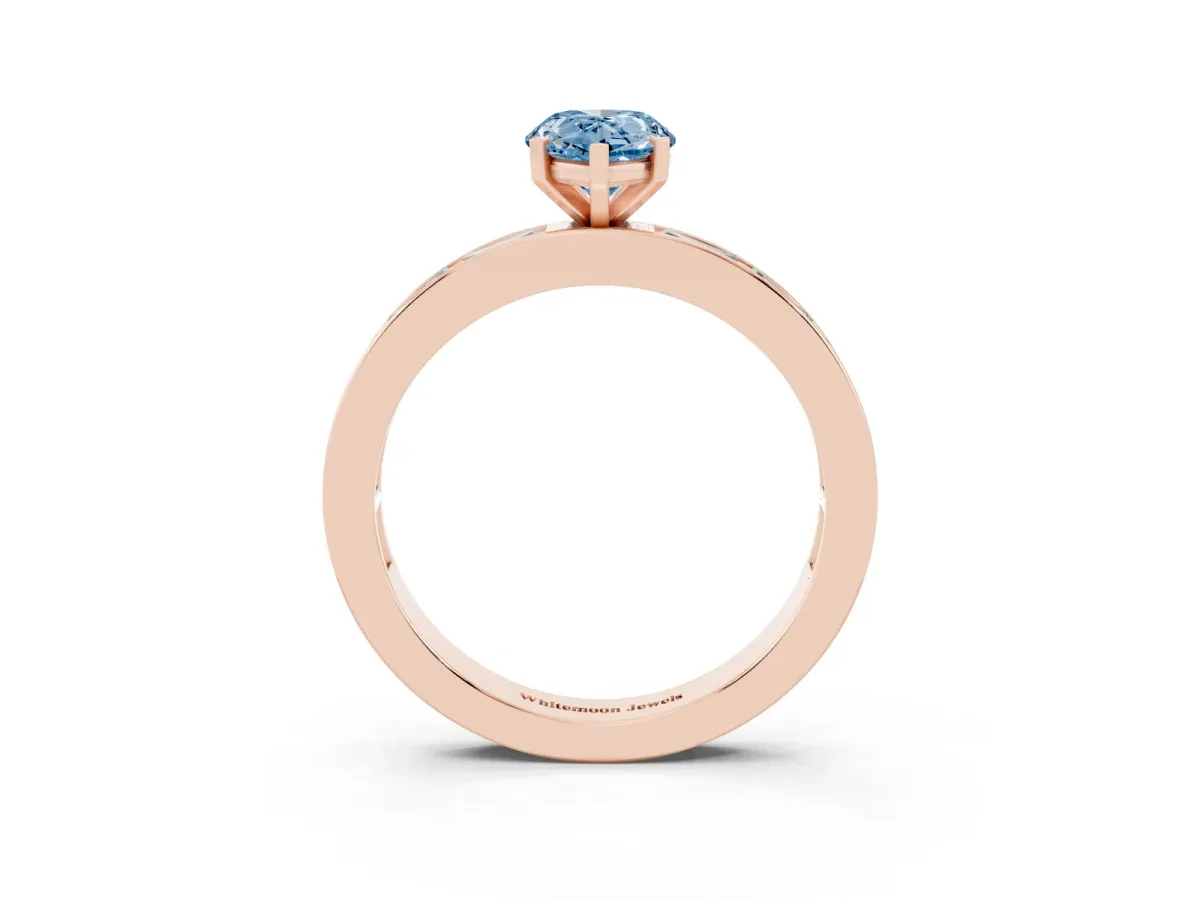 Fancy Blue Pear Cut Solitaire Diamond Ring with Channel-Set Baguette Band and Four-Prong Setting Rose gold