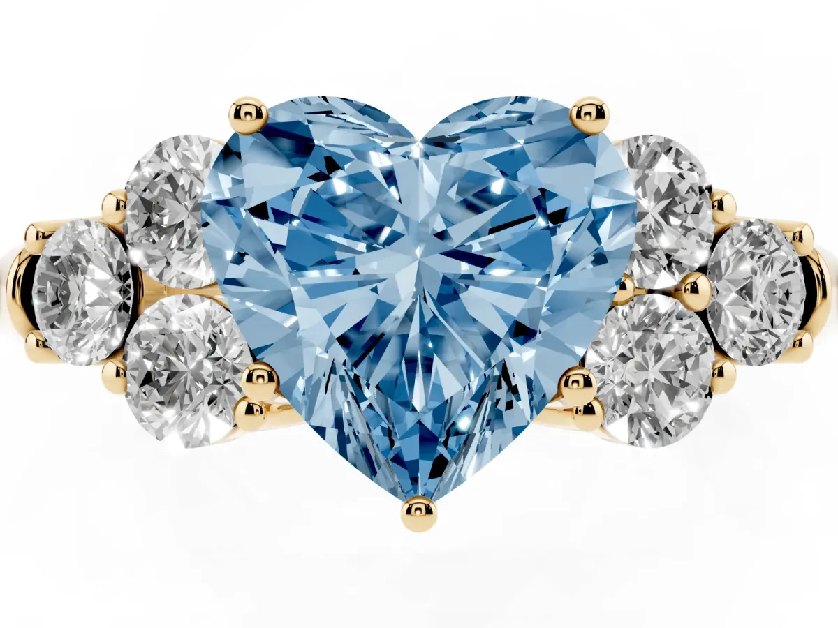 Fancy Blue Heart Cut Cut Diamond Cluster Ring with Round Accent Stones and Prong Setting on a Classic Band Yellow gold