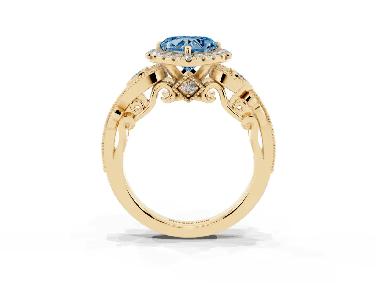 Fancy Blue Heart Cut Halo Diamond Ring with Milgrain and Bezel Accents on a Split Shank Band Yellow gold