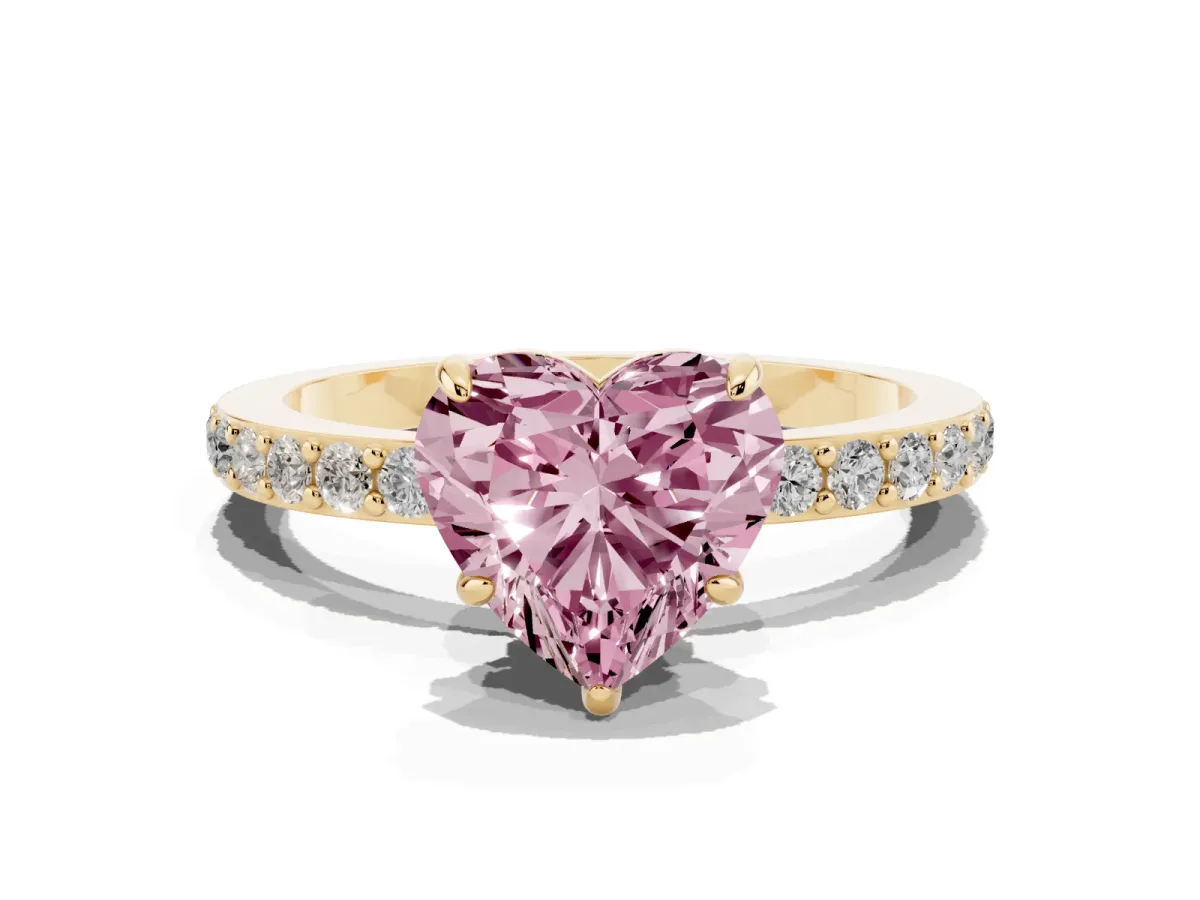 Fancy Pink Heart Cut Diamond Pavé Engagement Ring with Round Accents and Prong Setting Yellow gold