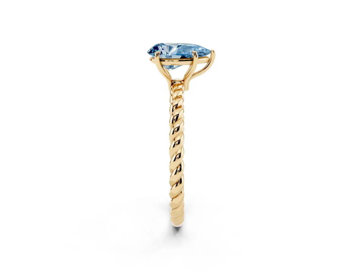 Fancy Blue Pear Cut Solitaire Twist Band Ring with Four-Prong Setting Yellow gold