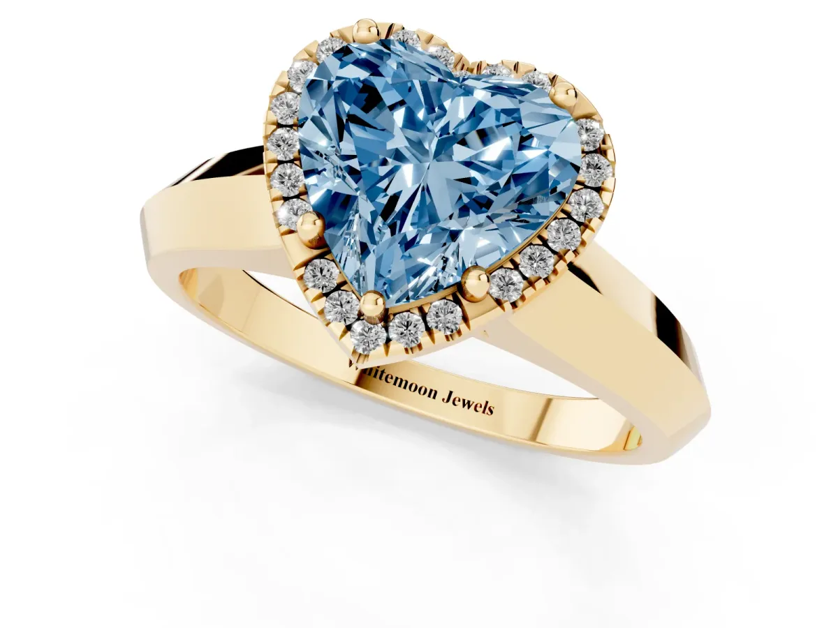 Fancy Blue Heart Cut Halo Diamond Ring with Cathedral Band and Four-Prong Setting Yellow gold