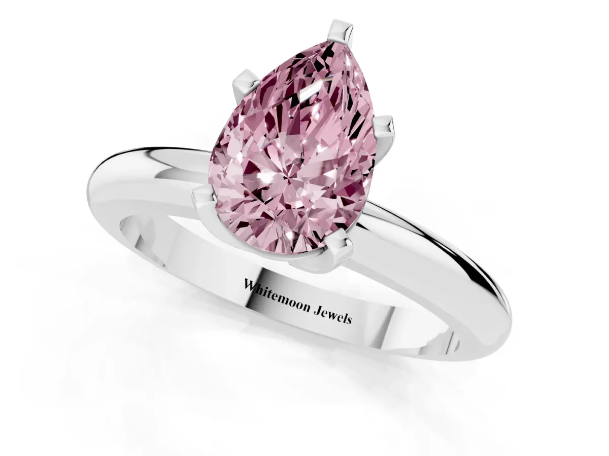 Fancy Pink Pear Cut Diamond Solitaire Engagement Ring with Round Band and Four-Prong Setting Platinum
