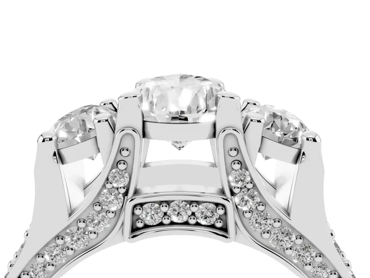 Pear Cut Diamond Three-Stone Ring with Channel Set Band and Four-Prong Setting Silver