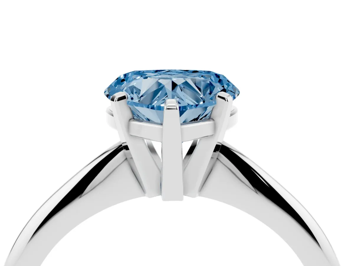Fancy Blue Heart Cut Cut Solitaire Ring with Four-Prong Setting on a Classic Band Silver