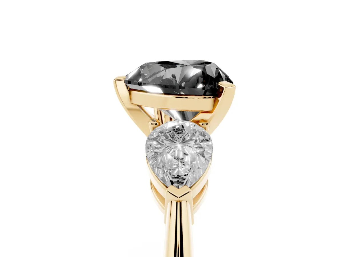 Fancy Black Three-Stone Heart Cut Diamond Ring with Pear Side Stones and Four-Prong Setting Yellow gold