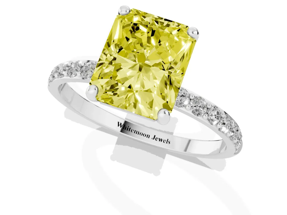 Fancy Yellow Radiant Cut Diamond Solitaire Ring with Round Pavé Band and Prong Setting Silver